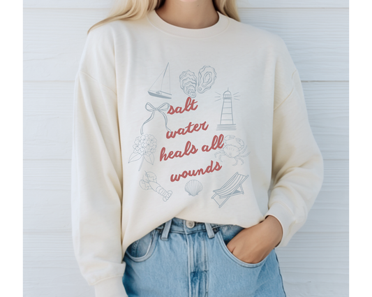 Saltwater Heals All Wounds Crewneck Sweatshirt Isla and Grace Coastal Icon Graphic T-shirt style sweatshirt